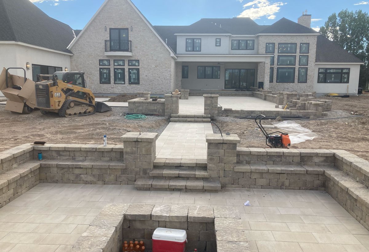Hardscape and patio base under construction by J&F